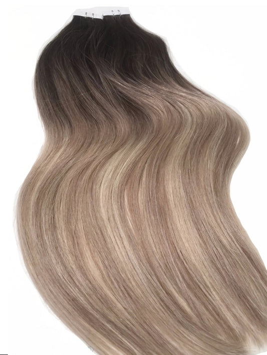 Dark brown 
roots to light brown caramel balayage