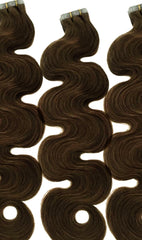 Wavy medium brown tape hair extensions